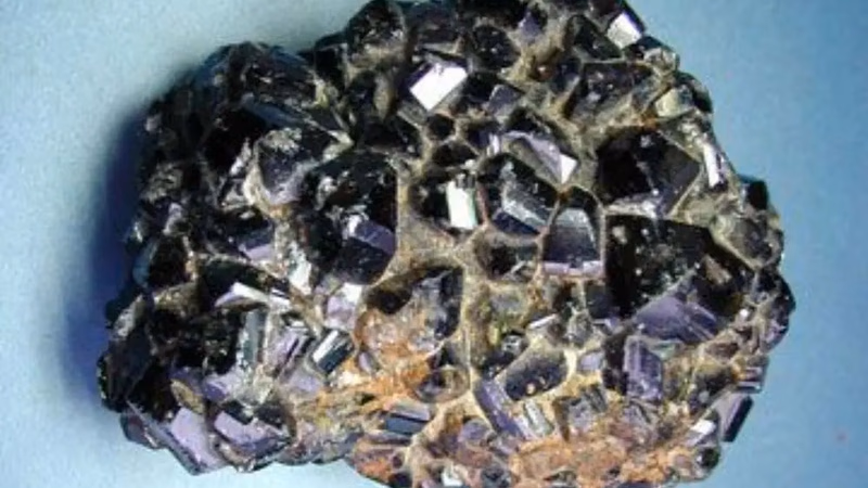 What is cassiterite and how is tin metal extracted from it?