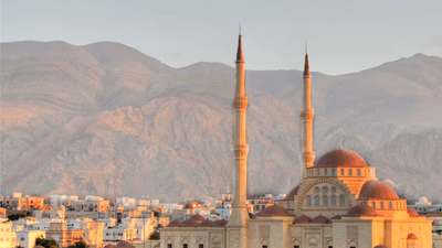 What is the religion and language of the people of Oman?