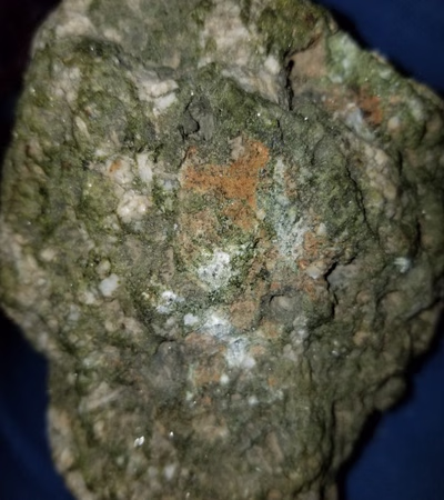 Meteorite stone of emerald and gold